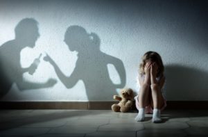 Little Girl Crying With a Shadow Of her Parents Arguing