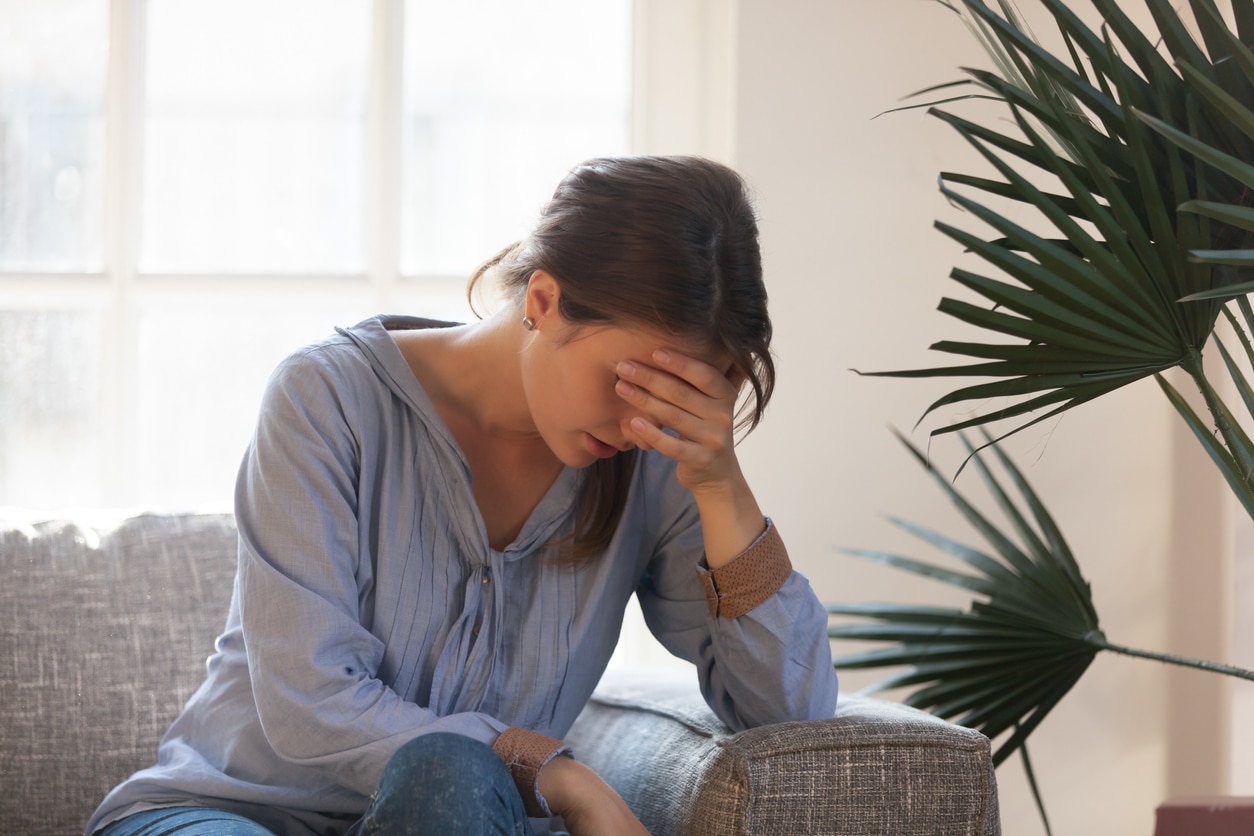 Upset young woman suffering from emotional abuse