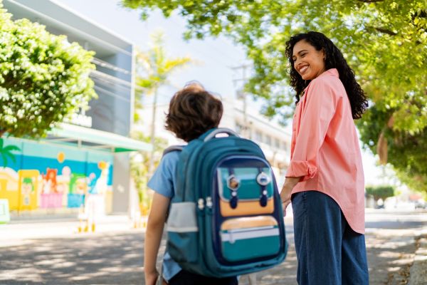 Mother and son talking on their way to school