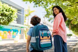 Mother and son talking on their way to school
